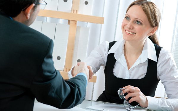 man and woman shaking hands